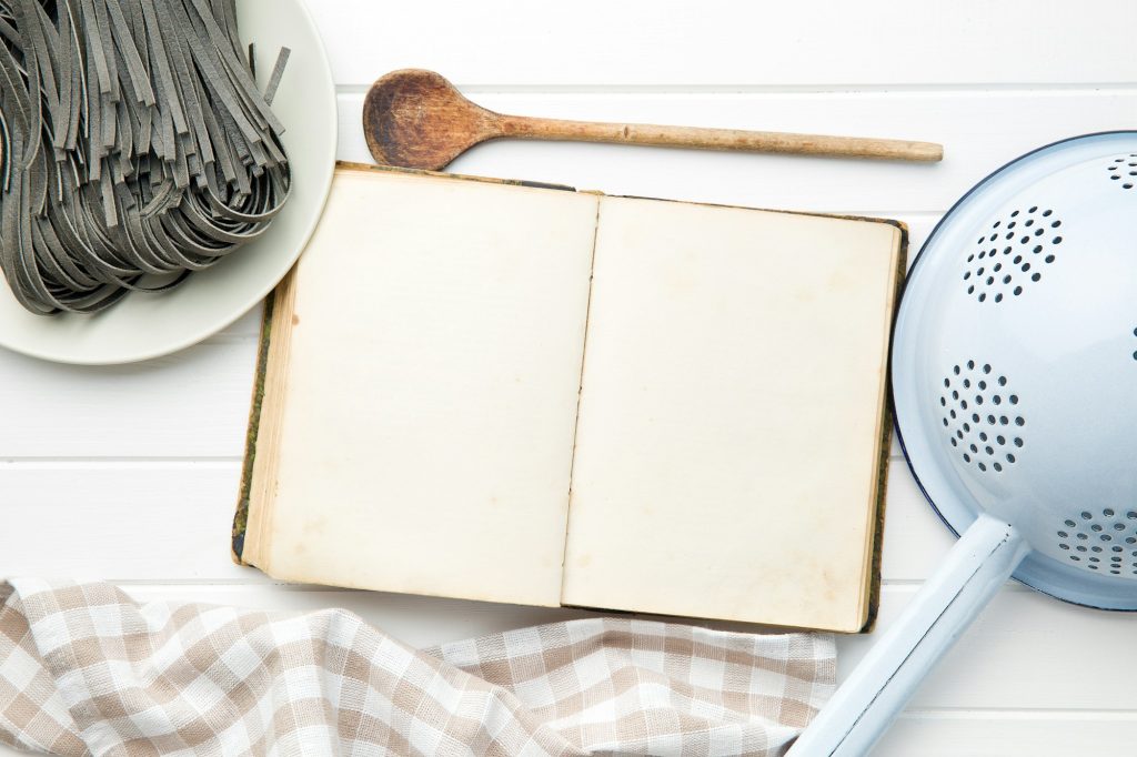 cookbook and black noodles with squid sepia ink