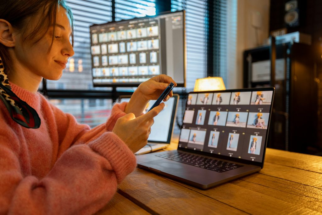 Photographer editing photos at home office